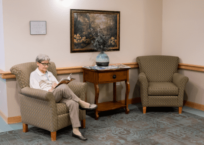 Sharmar Village resident reading book